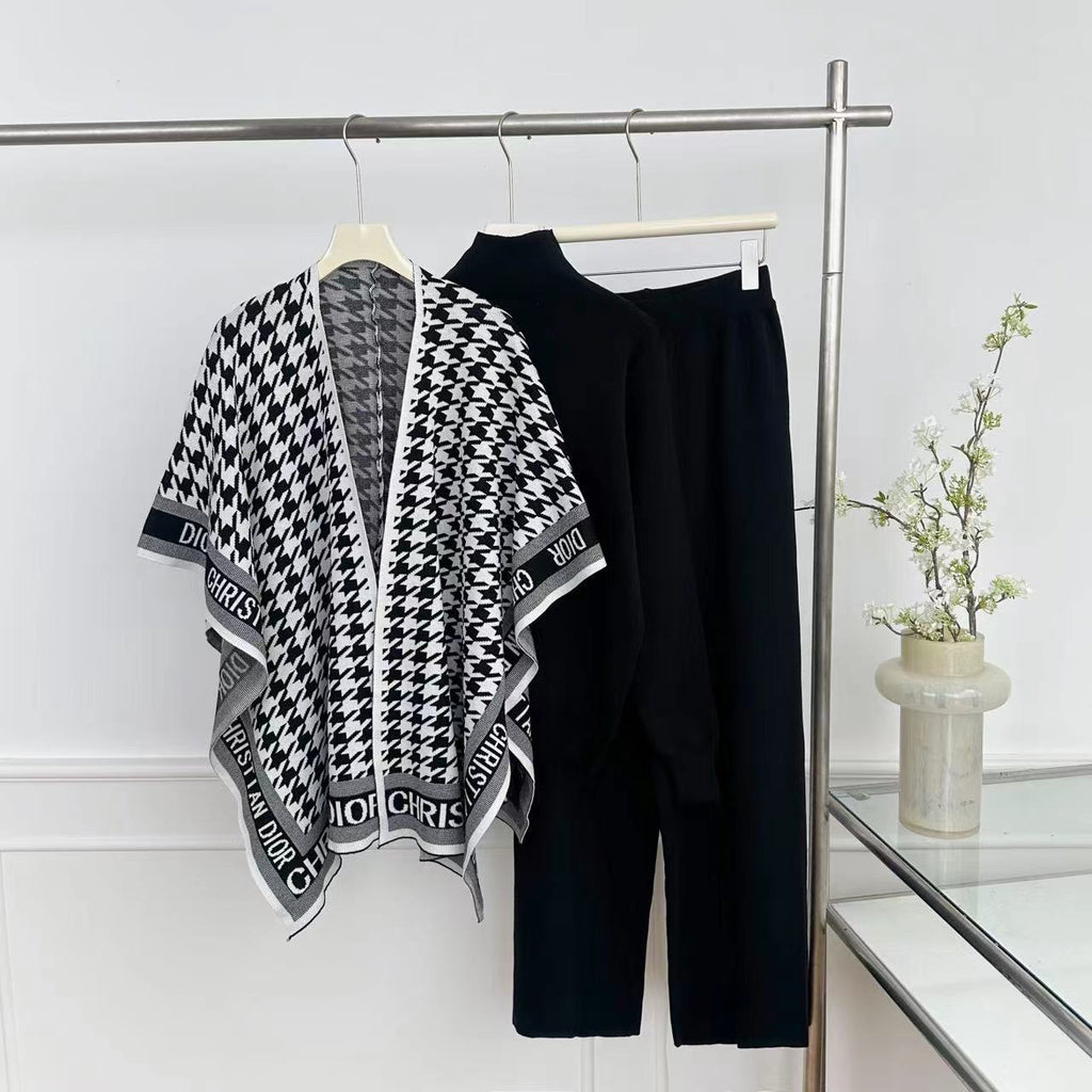 Black knit top and wide-leg pants with monochrome houndstooth wrap