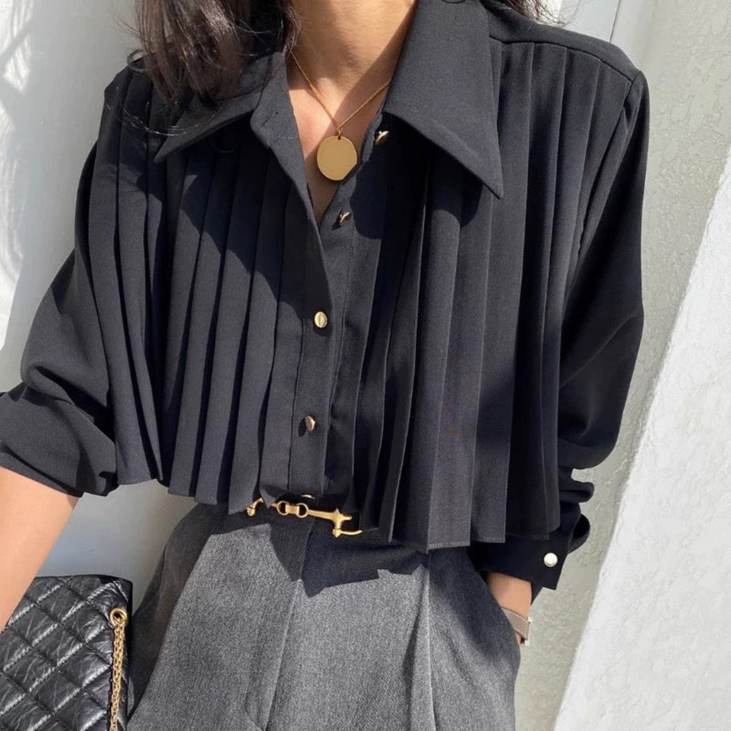 Black pleated cape collar polyblend shirt front view - woman wearing elegant button-down blouse with gold buttons