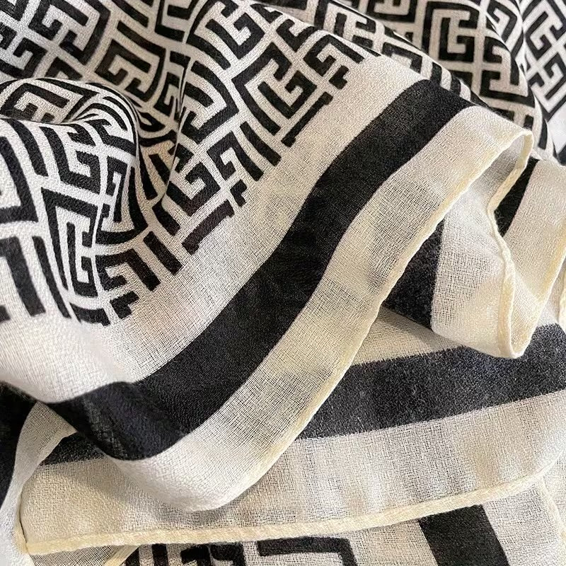 Detail shot of black white Greek key geometric pattern and viscose cotton fabric texture