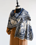 The Bleu Jardin Cashmere Wrap showing romantic blue garden botanical floral print on soft faux cashmere fabric in 185x65cm wrap format
