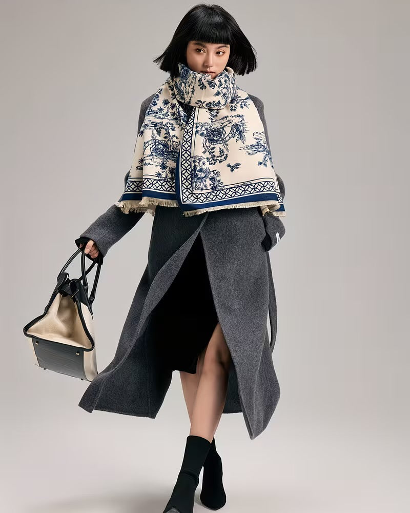 The Bleu Jardin Cashmere Wrap worn as shoulder wrap showing blue garden botanical print in elegant draped styling
