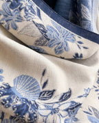 Close-up of The Blue Willow Reversible Wrap showing soft faux cashmere fabric texture with detailed blue and white chinoiserie willow botanical print
