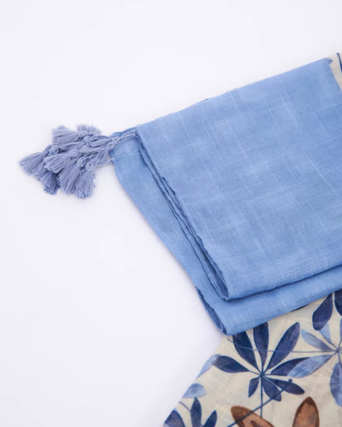The Bluebell Meadow Linen Stole in alternate styled look showing soft bluebell botanical print on natural breathable linen fabric
