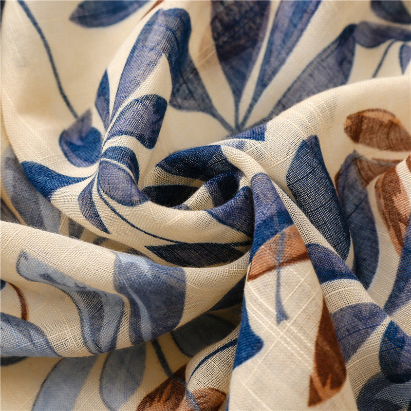 The Bluebell Meadow Linen Stole draped and styled showing full bluebell botanical print on natural linen stole
