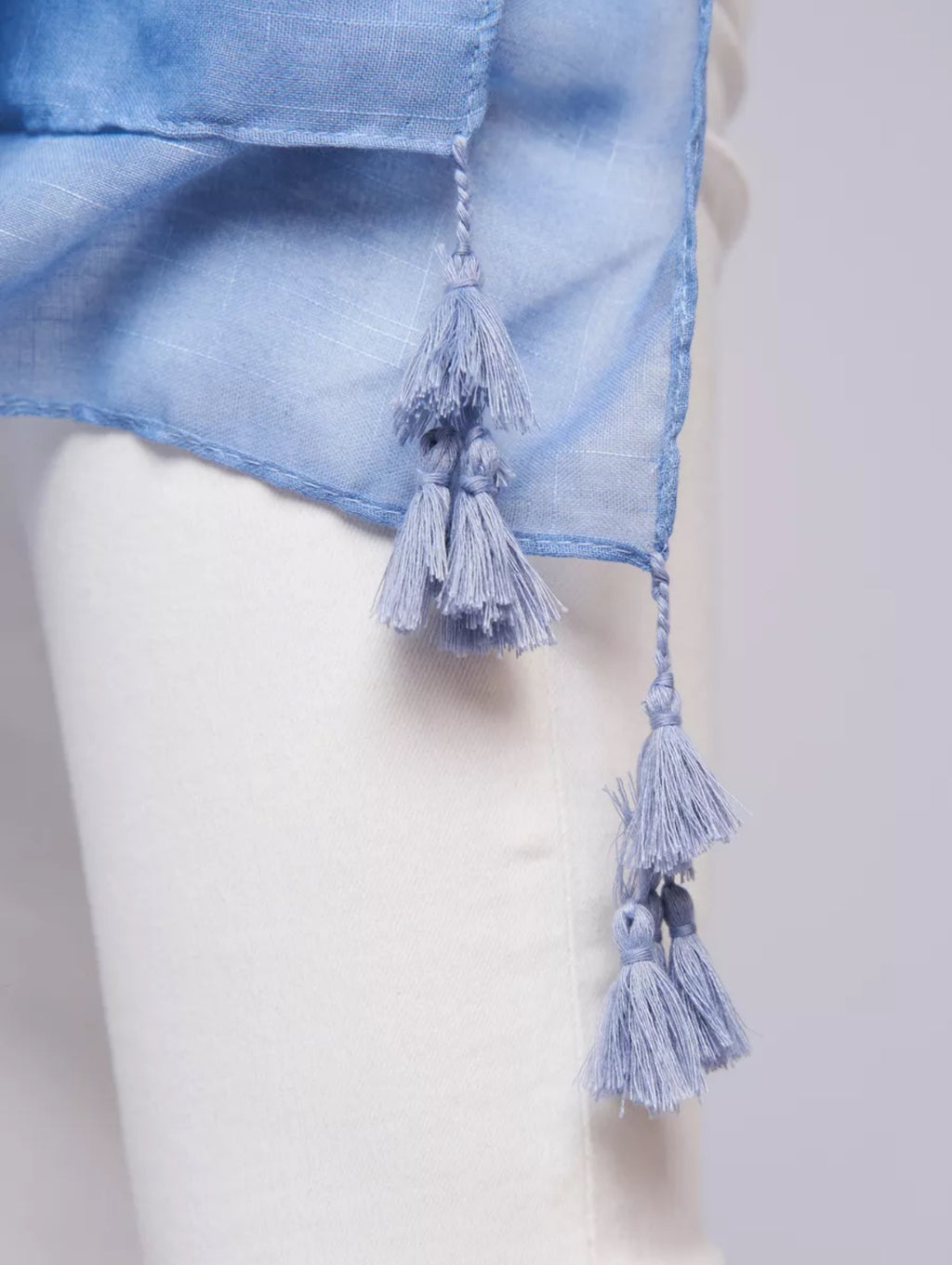 Close-up of The Bluebell Meadow Linen Stole showing natural linen fabric texture with detailed soft bluebell botanical print in blue and violet tones
