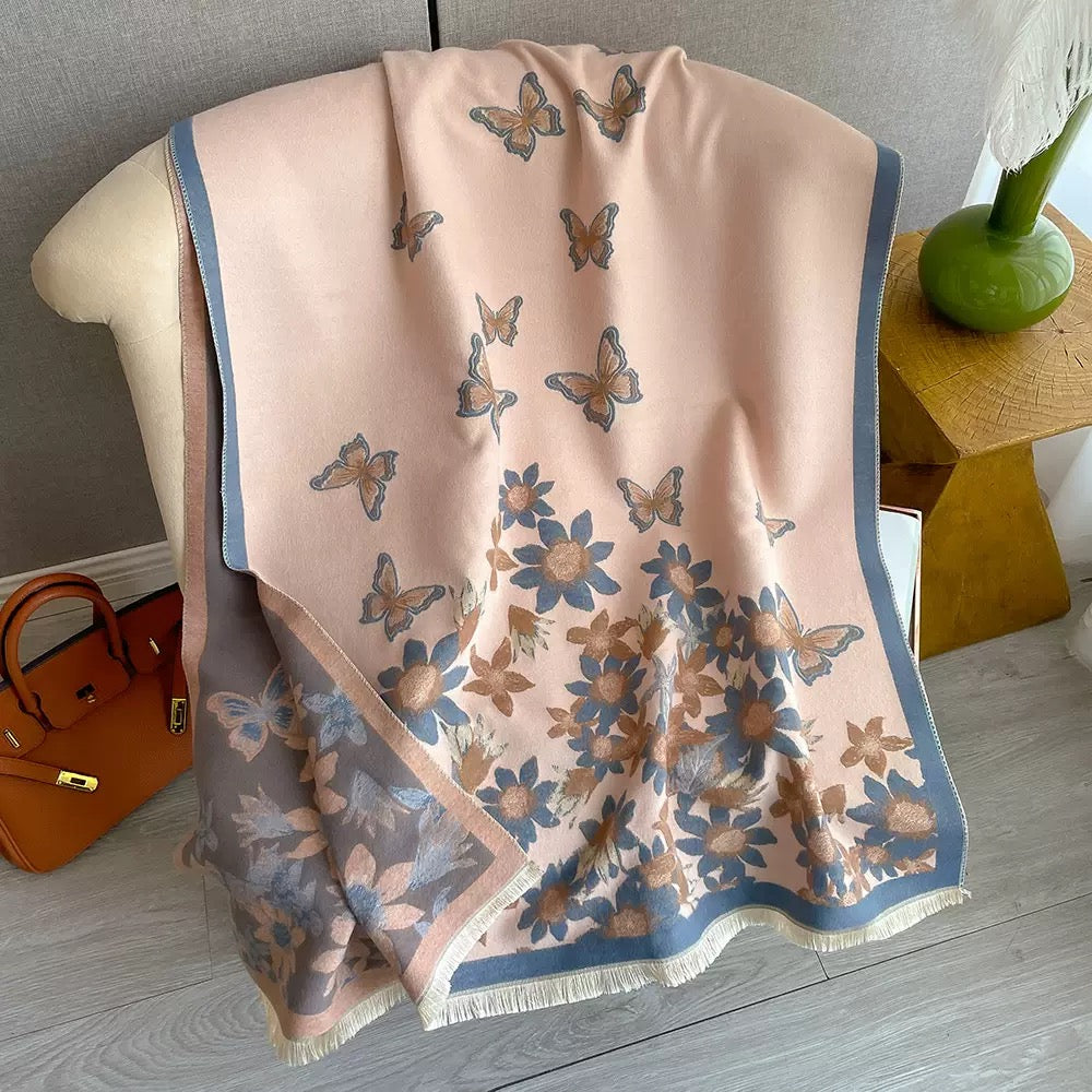 Blush Butterfly & Floral Reversible Cashmere-Feel Wrap draped and styled showing full butterfly and floral jacquard pattern on blush faux cashmere
