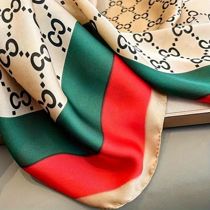 Monogram printed silk stole with red green border close-up fabric view