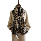Classic Safari Leopard Knit Wrap styled in a knotted neck wrap with bold leopard print and fringed edges