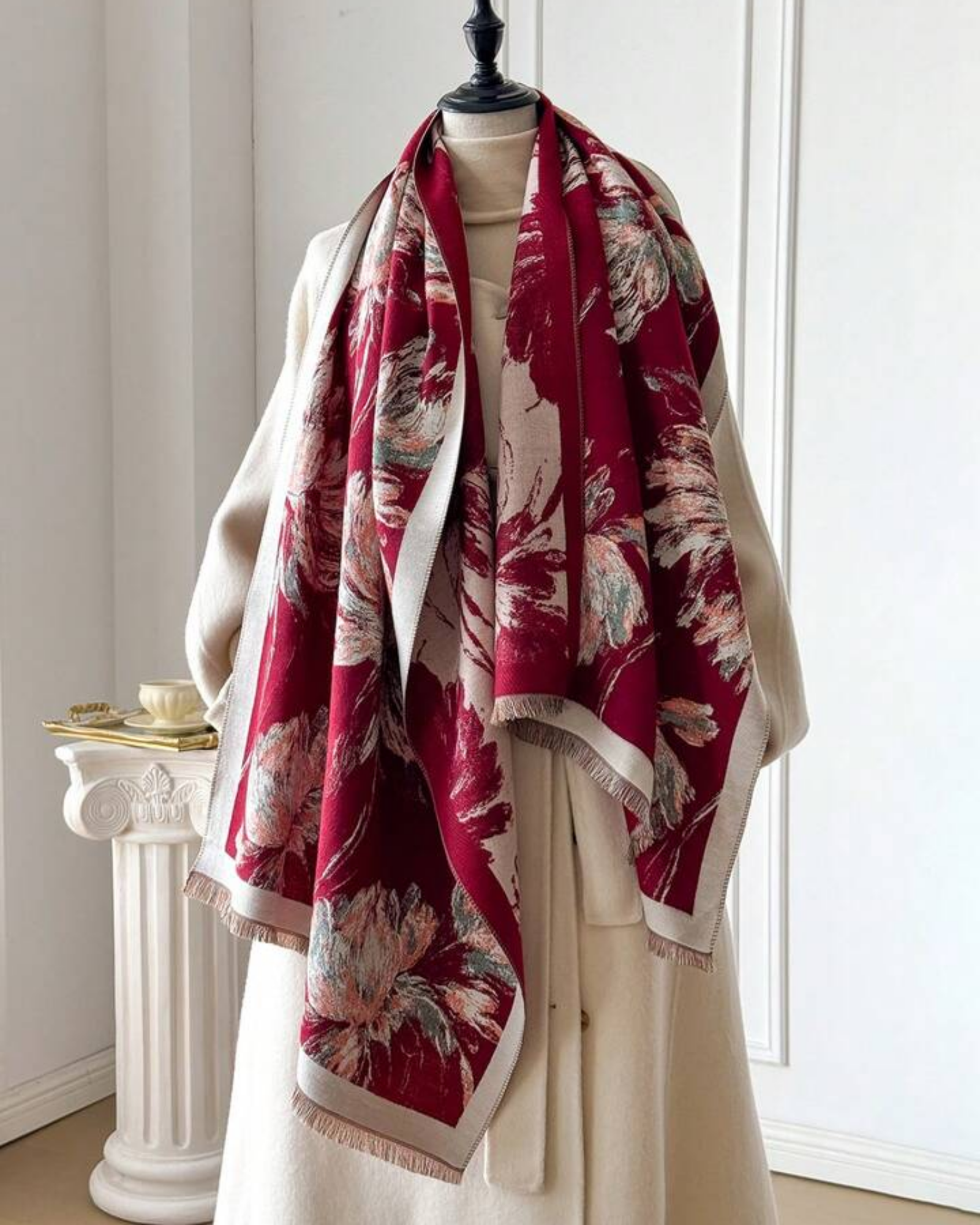 Crimson Dahlia Floral Cashmere-Blend Wrap draped and styled showing deep claret botanical dahlia jacquard print on cream faux cashmere ground
