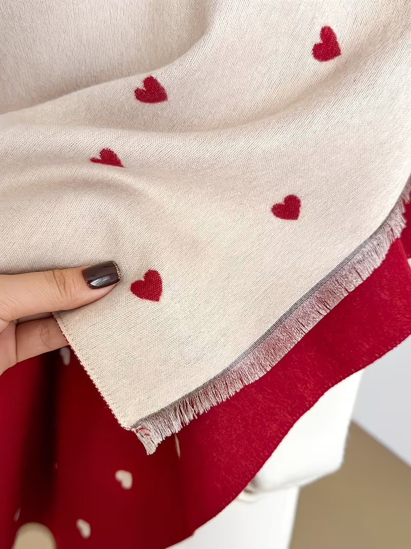 Close-up of The Crimson Hearts Cashmere Wrap showing soft faux cashmere fabric texture with detailed bold crimson heart motif print

