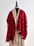 The Crimson Hearts Cashmere Wrap showing bold deep crimson heart motif print on soft faux cashmere fabric in 185x65cm wrap format
