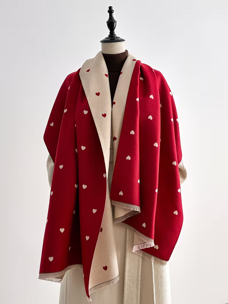 The Crimson Hearts Cashmere Wrap showing bold deep crimson heart motif print on soft faux cashmere fabric in 185x65cm wrap format
