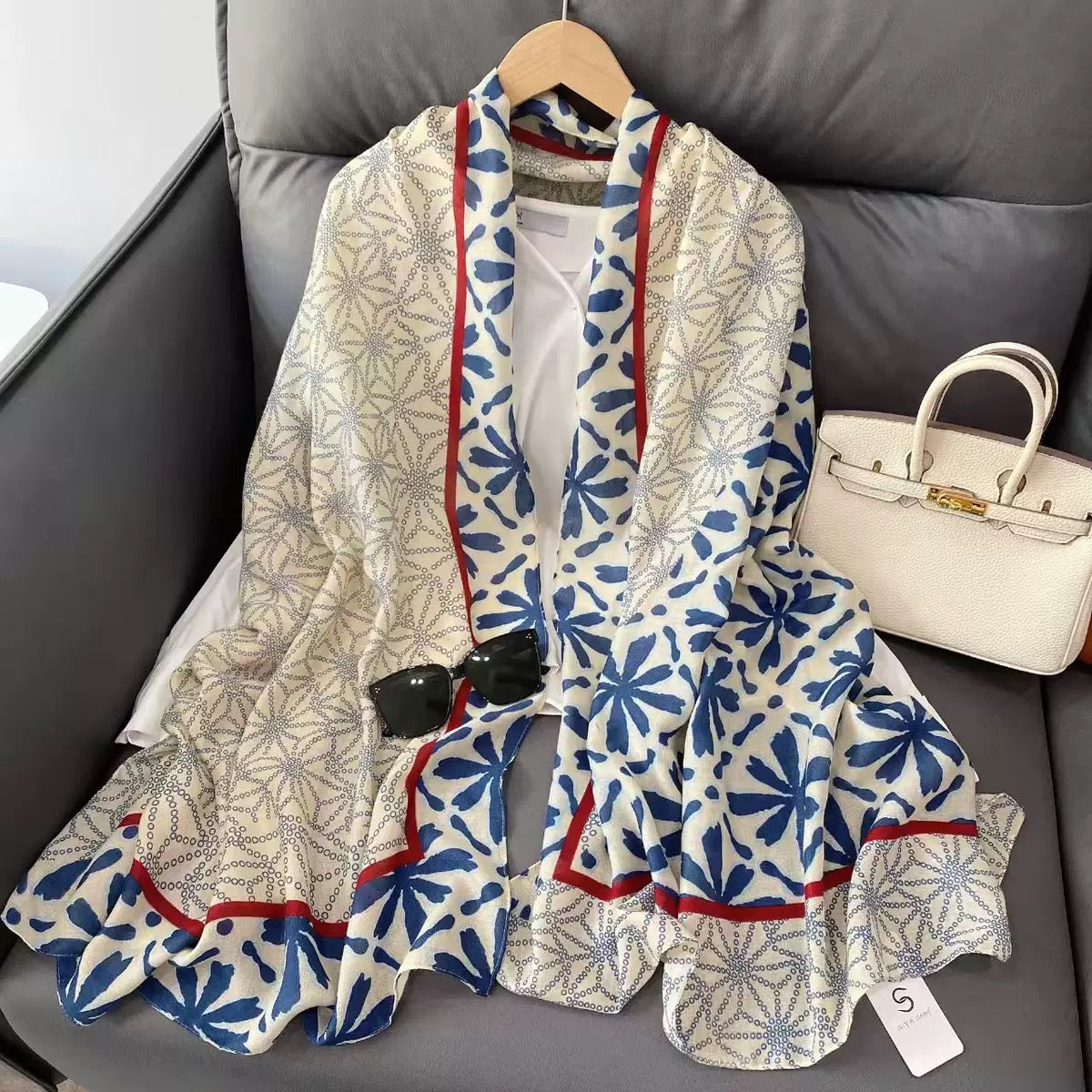 Elyria Indigo Bloom Stole flat lay with red trim border detail