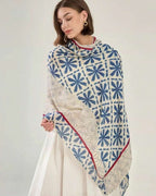 Woman wearing Elyria Indigo Bloom Stole, side draped view