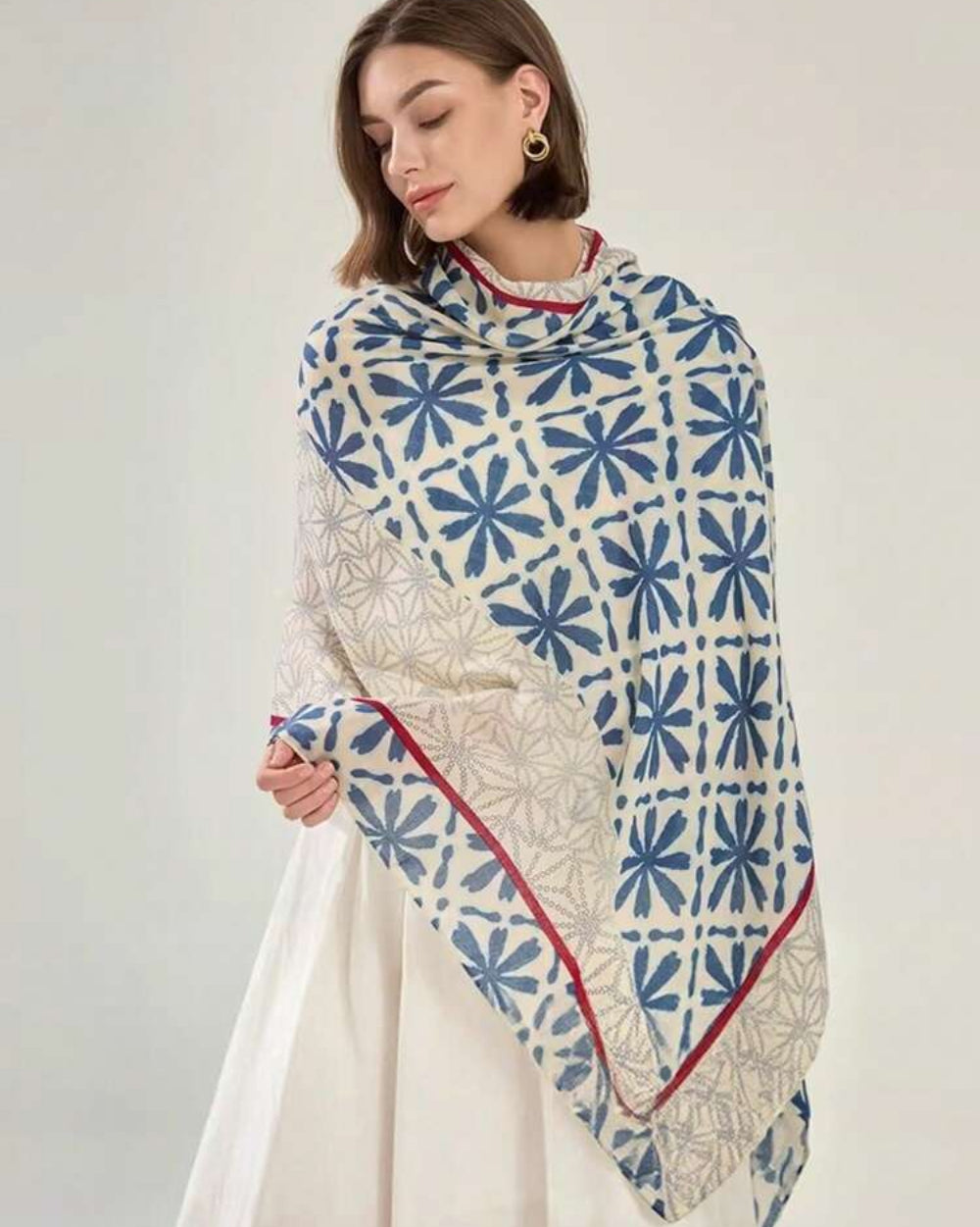 Woman wearing Elyria Indigo Bloom Stole, side draped view