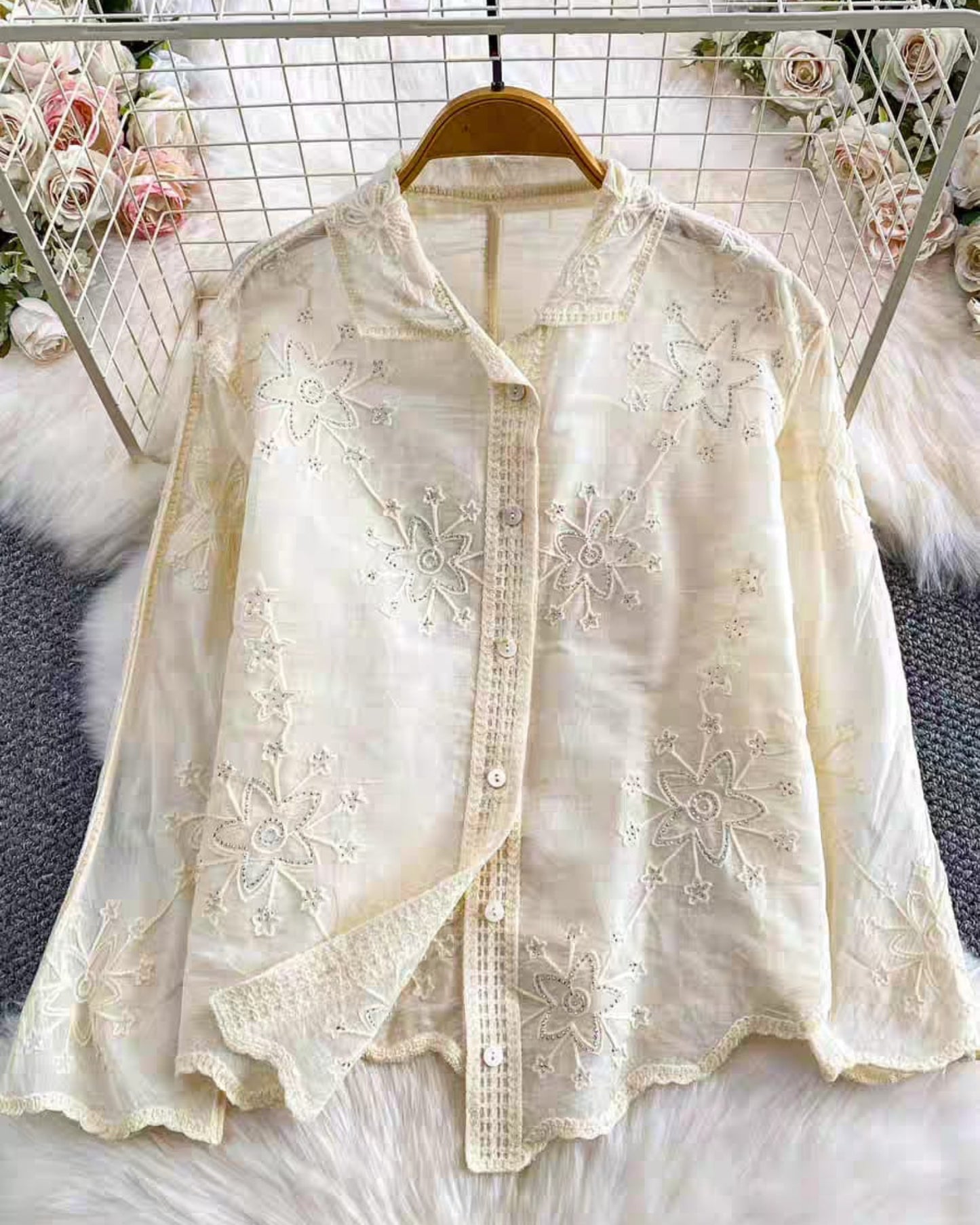 Back view of white embroidered linen cotton shirt with scalloped edges and silver details