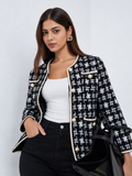 Women’s black and white geometric knit cardigan with pearl-effect buttons and braided trim by Westery Fashion House.
