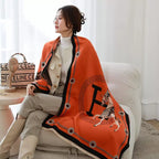 Model wearing The Equestrian Royale Knit Wrap styled as a luxurious winter shawl.