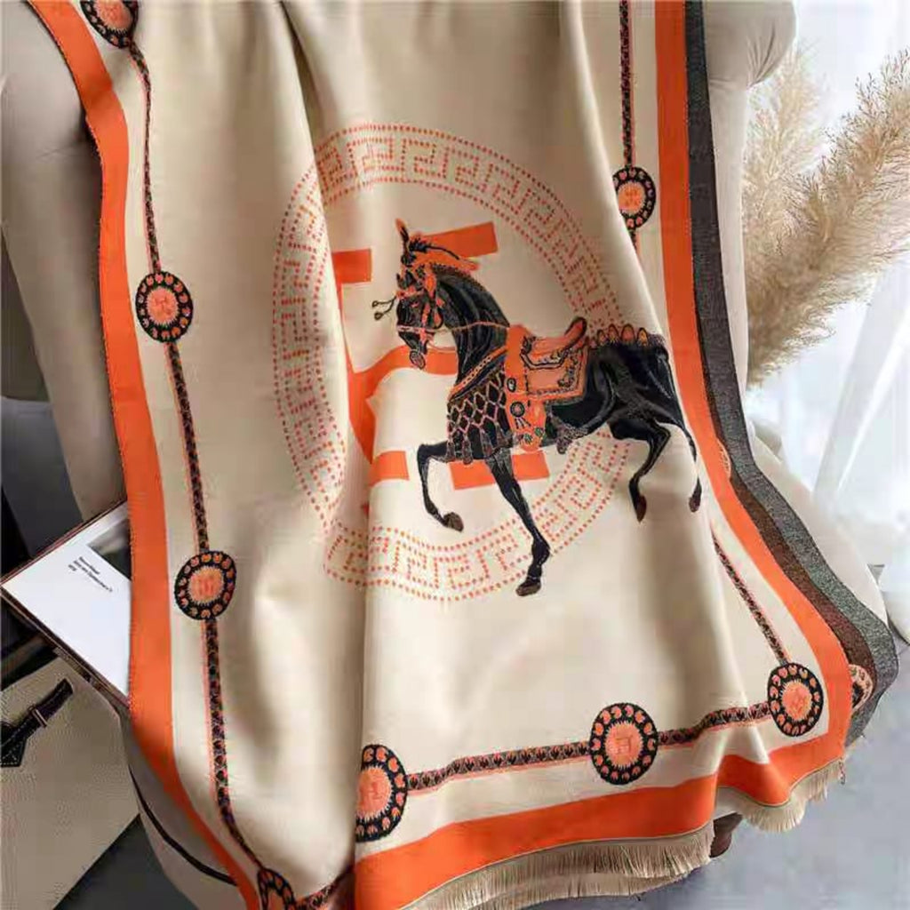     Soft faux cashmere texture and premium fringe detailing of The Equestrian Royale Knit Wrap.