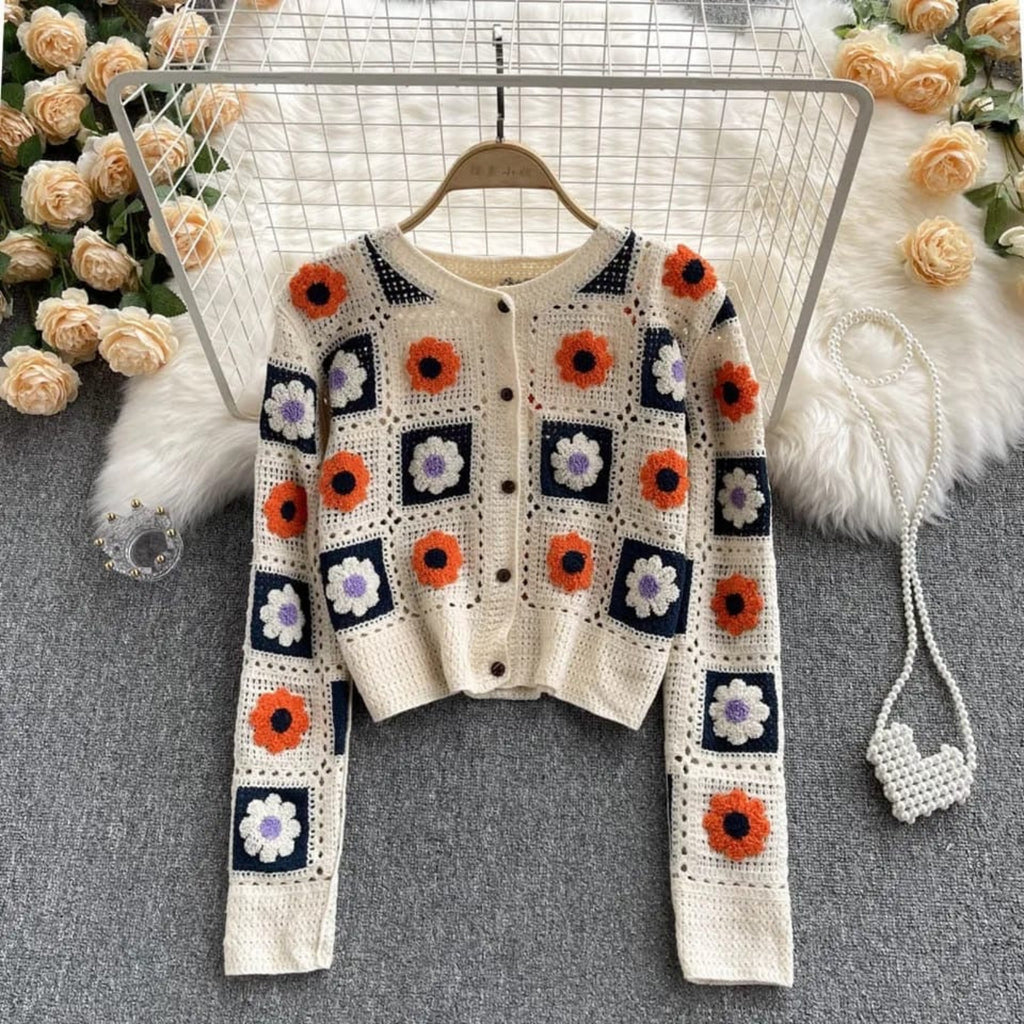 Garden Squares Crochet Cardigan in beige displayed on hanger showing full floral patchwork crochet design