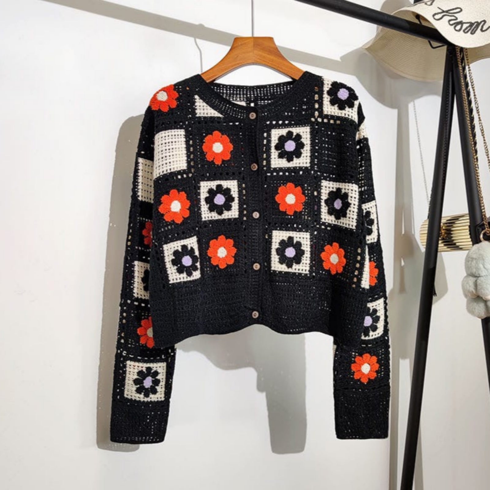 Garden Squares Crochet Cardigan in black with orange and purple floral granny-square crochet pattern