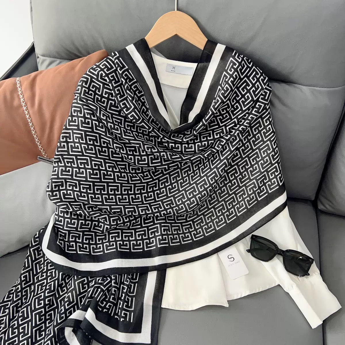 Close-up of Greek key geometric pattern on black white viscose cotton stole with striped border