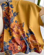 Golden Atelier Vintage Floral Faux Cashmere Wrap laid flat displaying full golden mustard vintage oil-painting floral print on soft faux cashmere fabric
