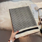 Flat lay of geometric Greek key pattern stole - black white designer scarf 180x90 cm