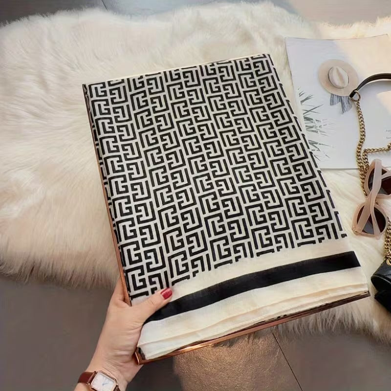 Flat lay of geometric Greek key pattern stole - black white designer scarf 180x90 cm