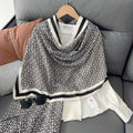 Woman styling black white Greek key stole over white shirt - professional office look