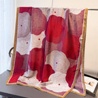 Full view of the Hafi Elegant Floral Silk Scarf featuring oversized geometric floral motifs in crimson red and ivory with a golden brown border, size 180 × 90 cm.  