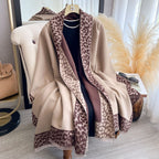 Hazelnut Leopard Trim Wrap draped as a cape showing camel fabric with brown leopard print border