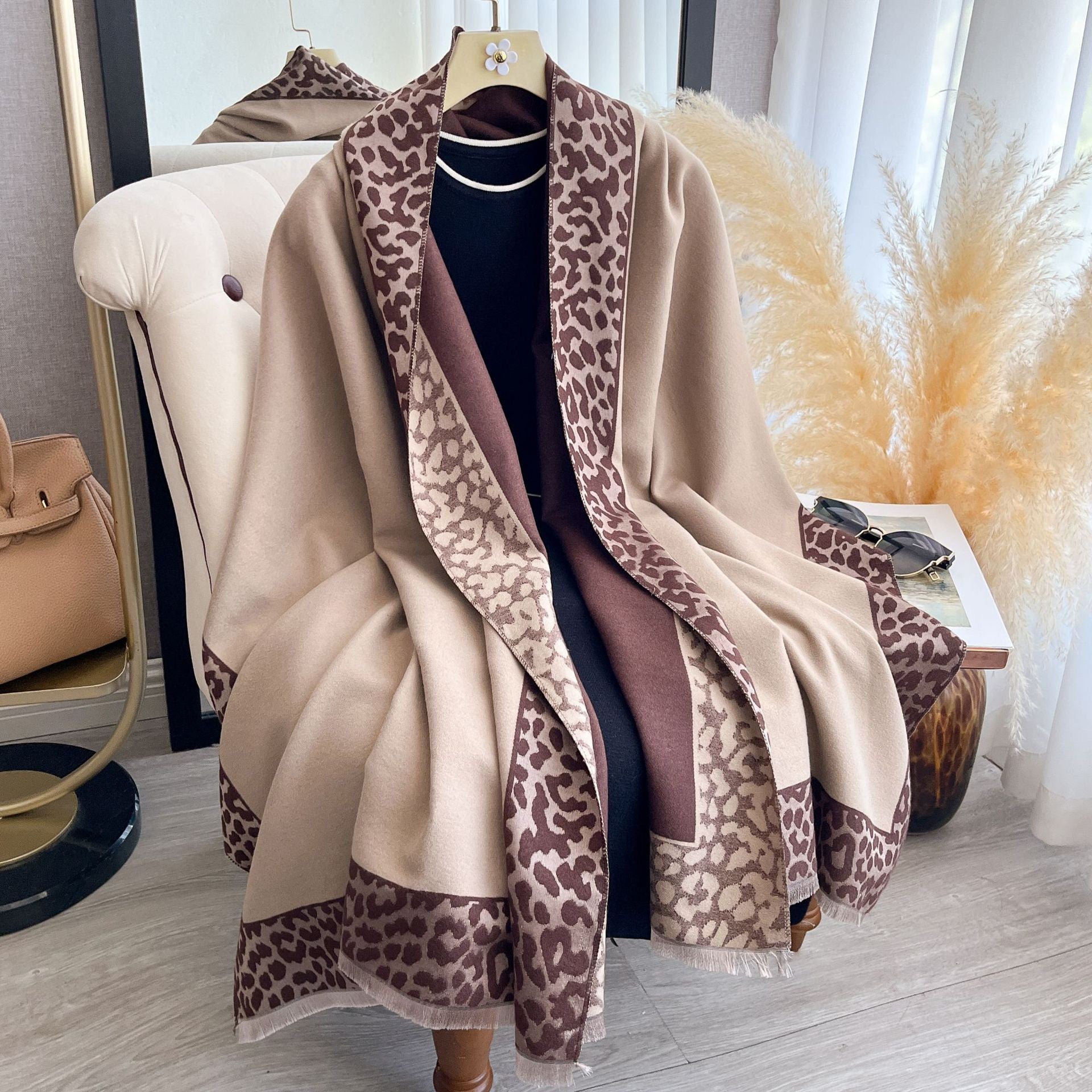 Hazelnut Leopard Trim Wrap draped as a cape showing camel fabric with brown leopard print border