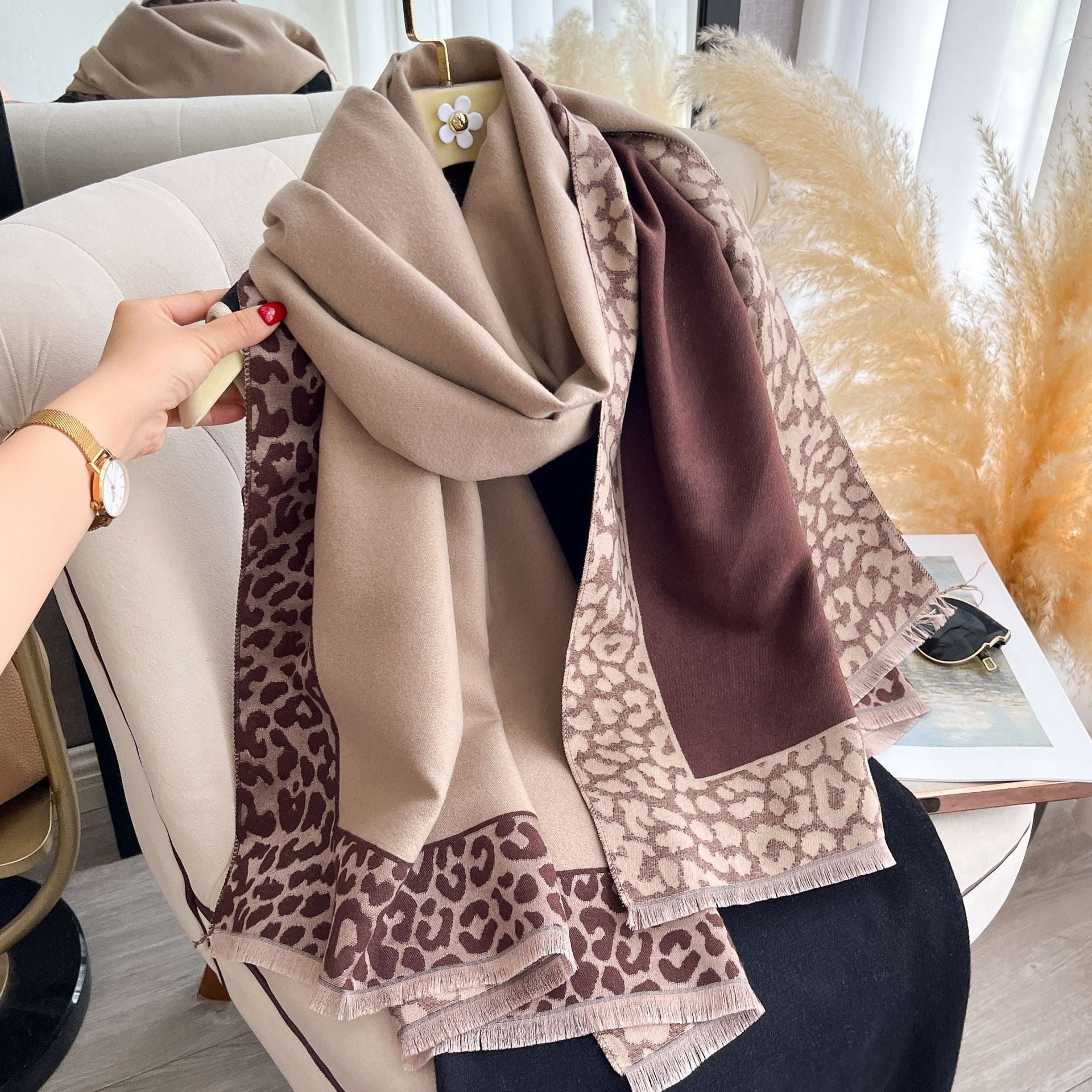Hazelnut Leopard Trim Wrap wrapped around shoulders showing leopard print border and fringe detail