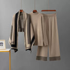Beige knit top and wide-leg pants with houndstooth shawl