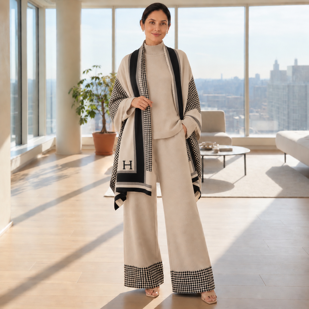Woman wearing beige knit co-ord set with houndstooth statement shawl