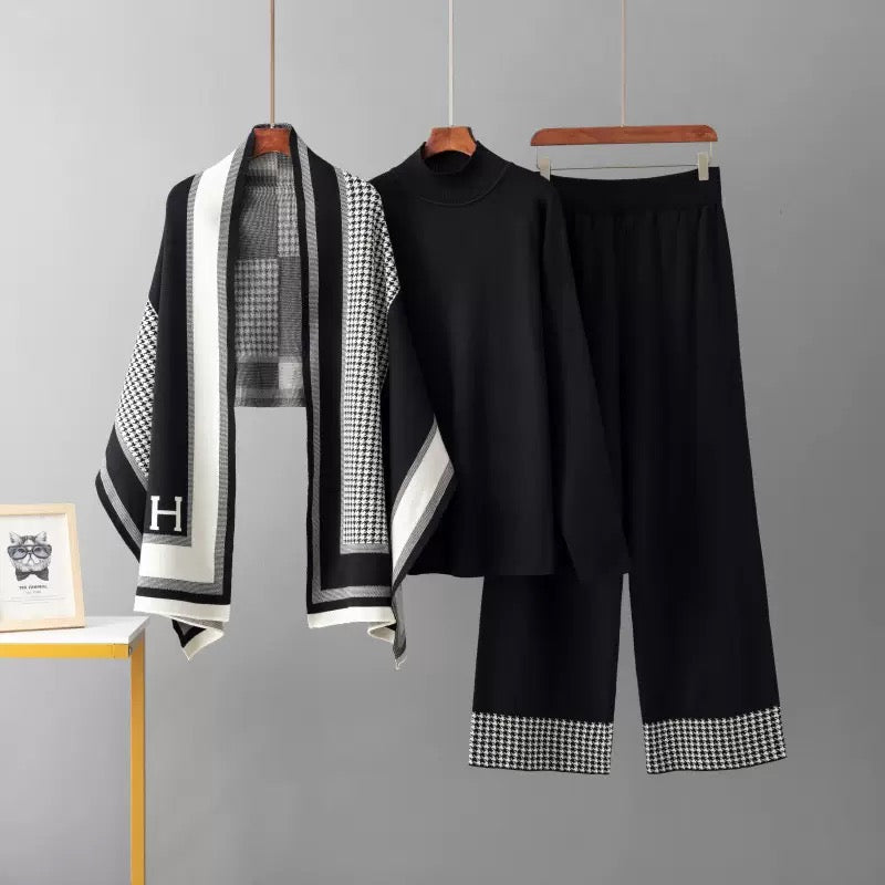 Black knit top and wide-leg pants with houndstooth shawl
