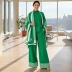 Woman wearing green knit co-ord set with houndstooth statement shawl