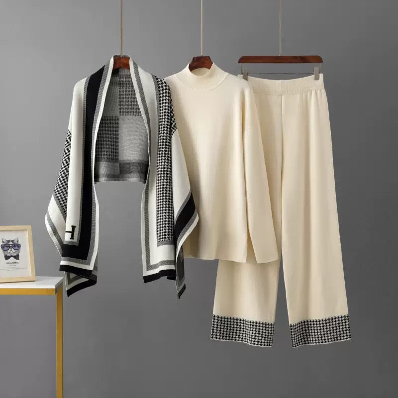 Ivory knit top and wide-leg pants with houndstooth shawl