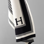Close-up of houndstooth knit shawl with contrasting border detail
