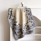 Heritage Meadow Toile de Jouy Inspired Scarf laid flat showing full slate-blue botanical toile de jouy pattern on cream faux cashmere fabric
