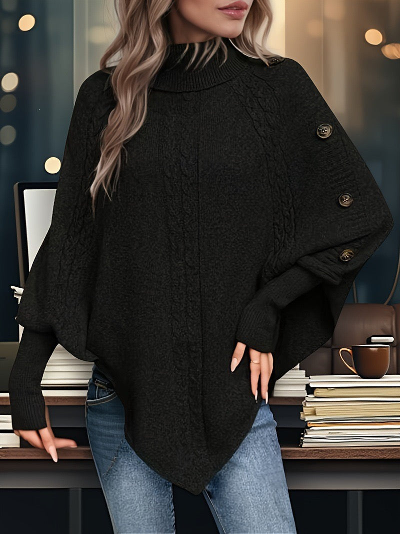 Women's midnight black cable-knit cape sweater with high neck and decorative shoulder buttons