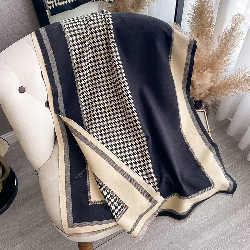 The Kensington Houndstooth Wrap laid flat displaying full classic houndstooth two-tone check pattern on faux cashmere fabric
