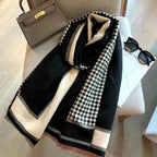 The Kensington Houndstooth Wrap wrapped around neck showing classic houndstooth pattern and soft faux cashmere drape
