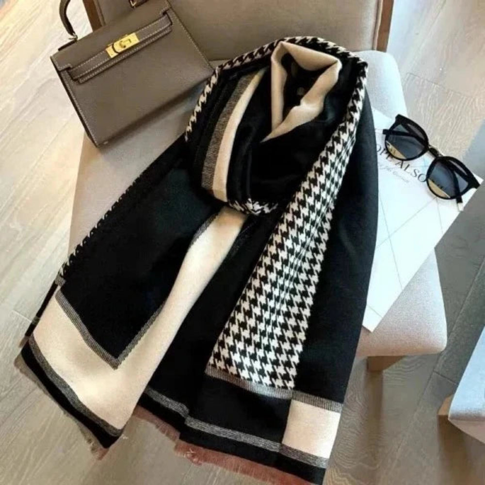 The Kensington Houndstooth Wrap wrapped around neck showing classic houndstooth pattern and soft faux cashmere drape
