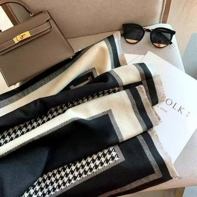 Close-up of The Kensington Houndstooth Wrap showing soft faux cashmere fabric texture with detailed classic two-tone houndstooth check pattern
