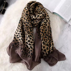 Leopard Whisper Stole in brown satin displayed flat, showcasing the soft sheen and leopard print design.