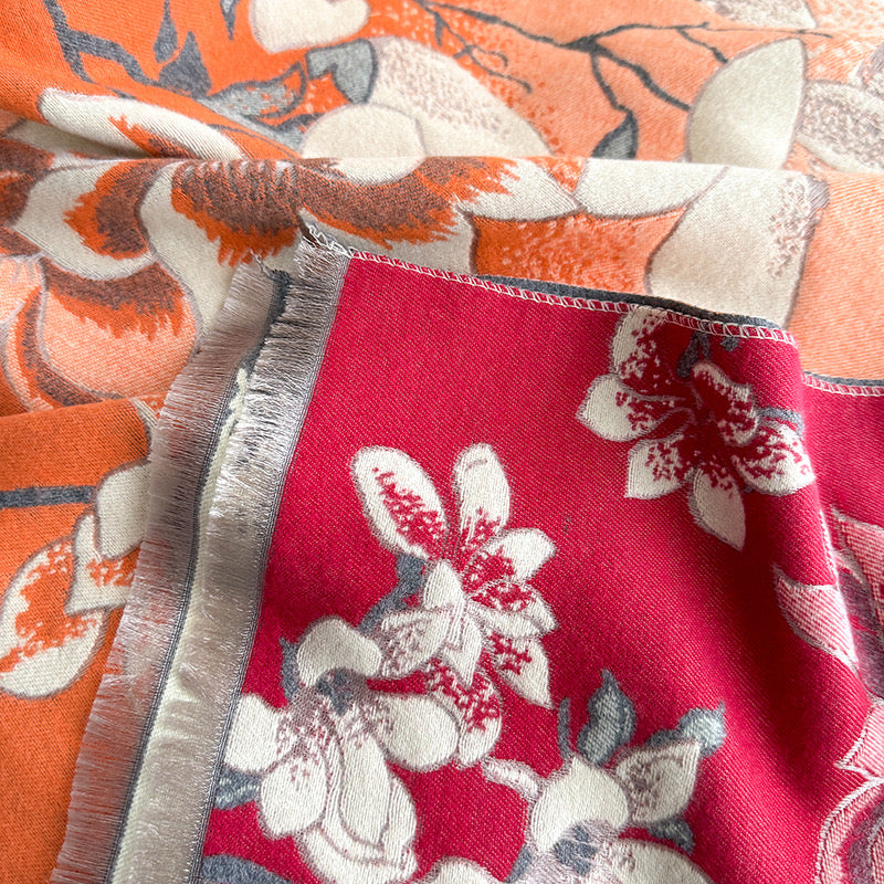 Close-up of Magnolia Dusk Cashmere Stole fringe trim and woven faux cashmere fabric texture