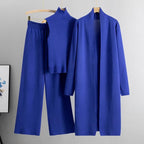 Royal blue 3-piece knit co-ord set laid flat showing top, pants, and cardigan
