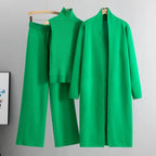 Green 3-piece knit co-ord set laid flat showing top, pants, and cardigan
